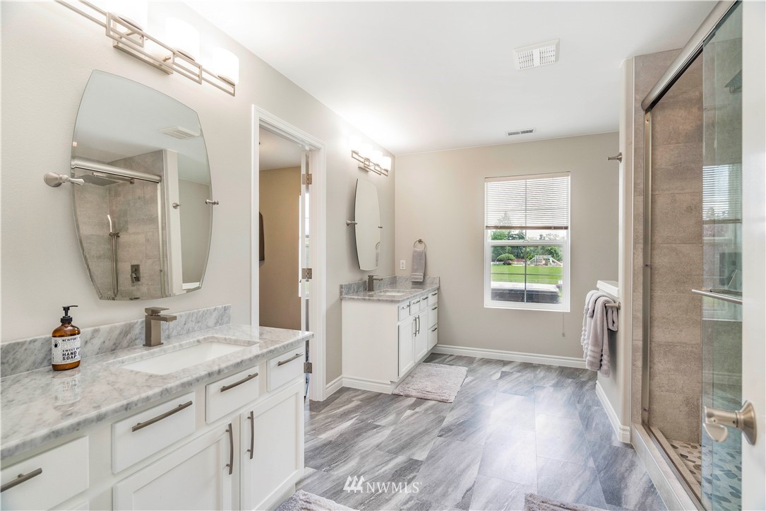 3719 154th Place Southeast Bothell, WA 98012 - Photo 22 of 37 a spacious bathroom with a granite countertop sink mirror and a