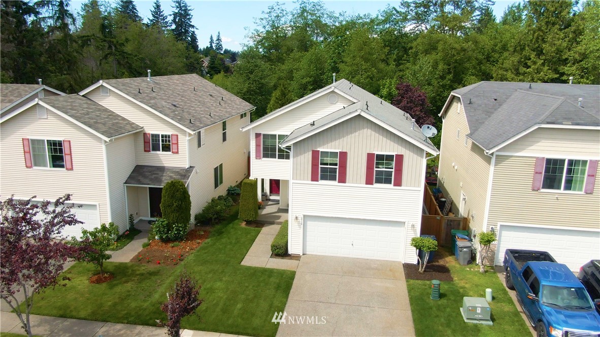 3719 154th Place Southeast Bothell, WA 98012 - Photo 28 of 37 a view of house with garden