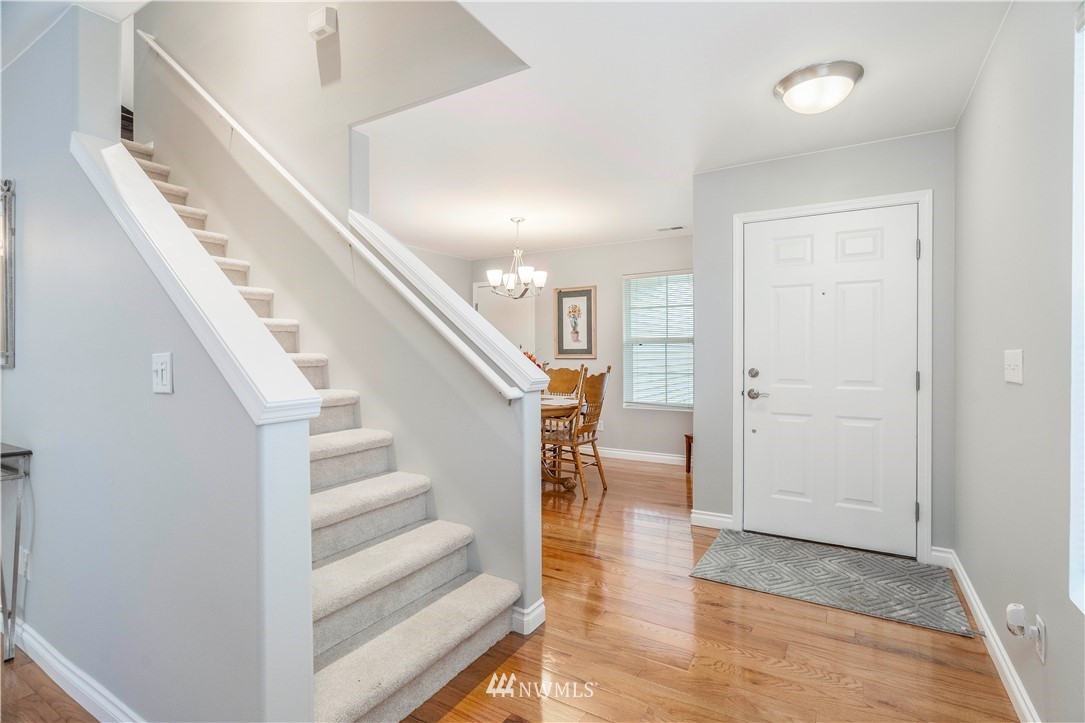 3719 154th Place Southeast Bothell, WA 98012 - Photo 4 of 37 a view of entryway and hall with wooden floor