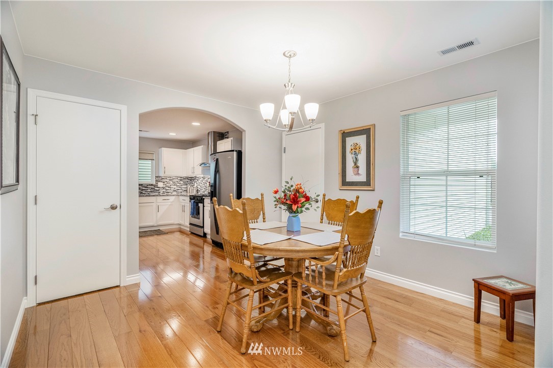 3719 154th Place Southeast Bothell, WA 98012 - Photo 5 of 37 a view of a dining room with furniture and wooden floor