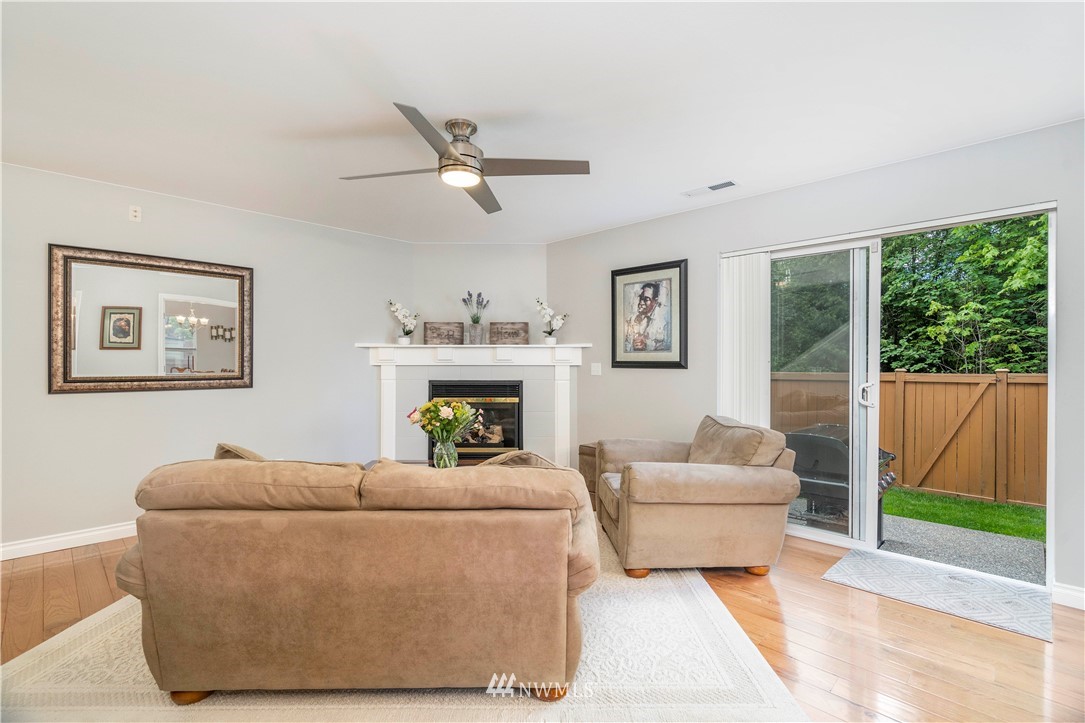 3719 154th Place Southeast Bothell, WA 98012 - Photo 10 of 37 a living room with furniture and a fireplace