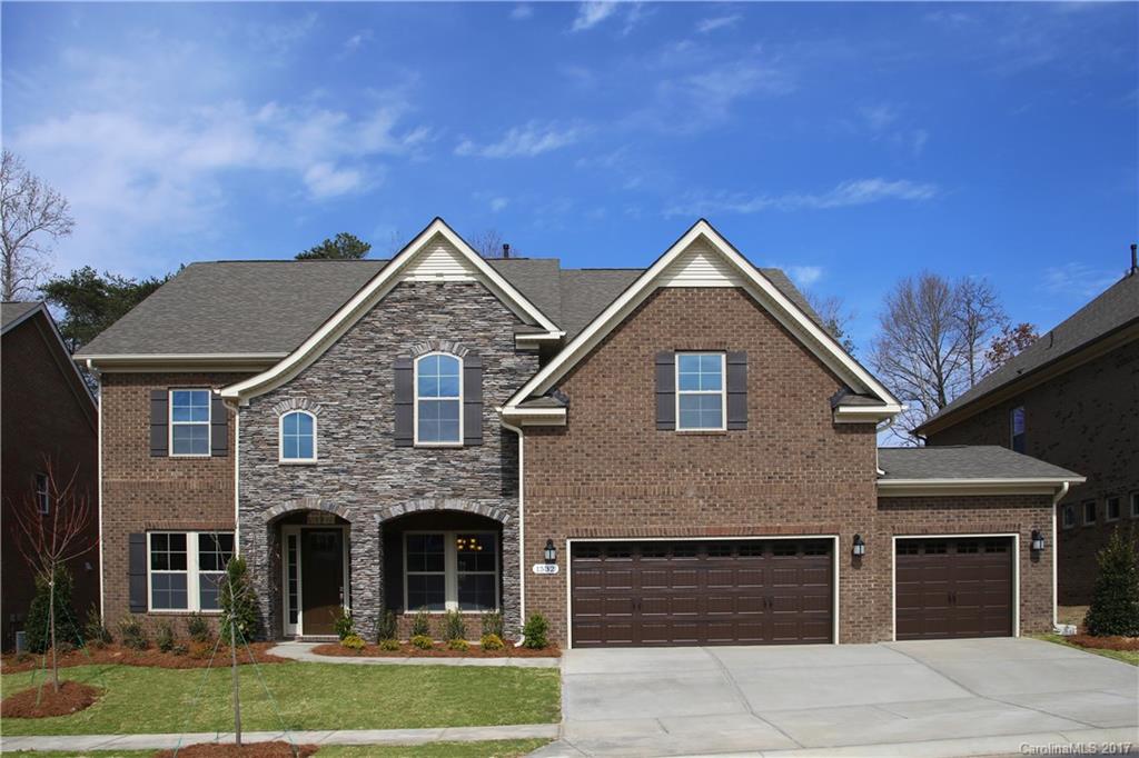 1532 Afton Way, Unit 168 Fort Mill, SC 29708 - Photo 1 of 19 a front view of a house with garden