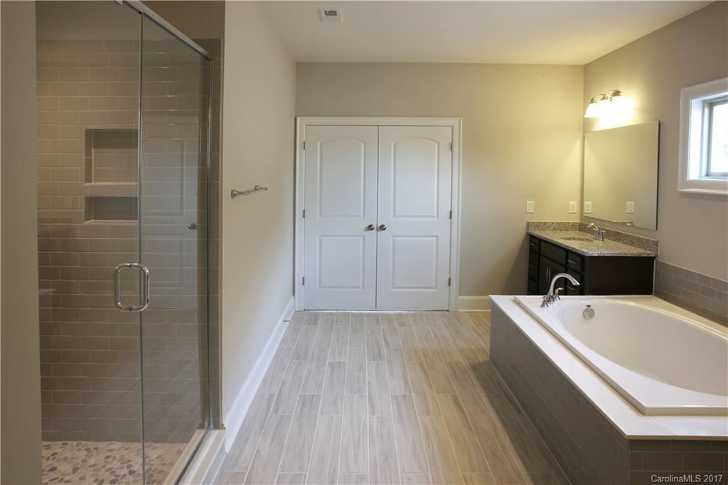 1532 Afton Way, Unit 168 Fort Mill, SC 29708 - Photo 19 of 19 a bathroom with a tub and shower