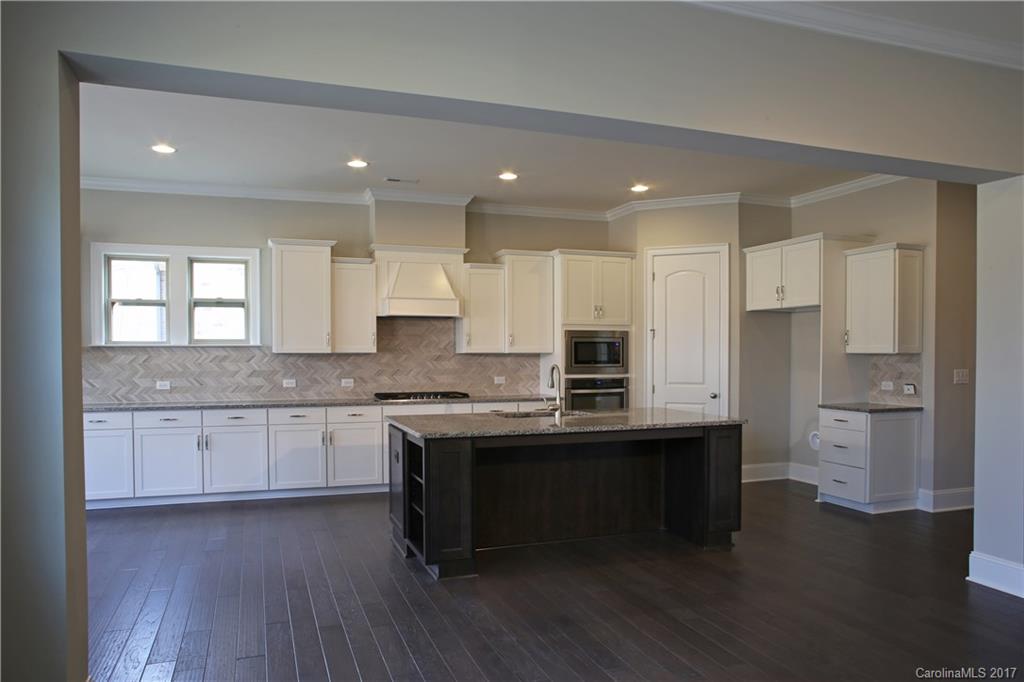 1532 Afton Way, Unit 168 Fort Mill, SC 29708 - Photo 3 of 19 a kitchen with stainless steel appliances granite countertop a sink a stove and a refrigerator