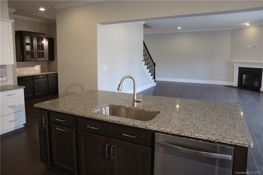 1532 Afton Way, Unit 168 Fort Mill, SC 29708 - Photo 4 of 19 a kitchen with granite countertop a sink and cabinets