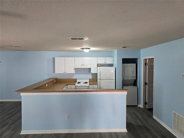 a room with wooden cabinets
