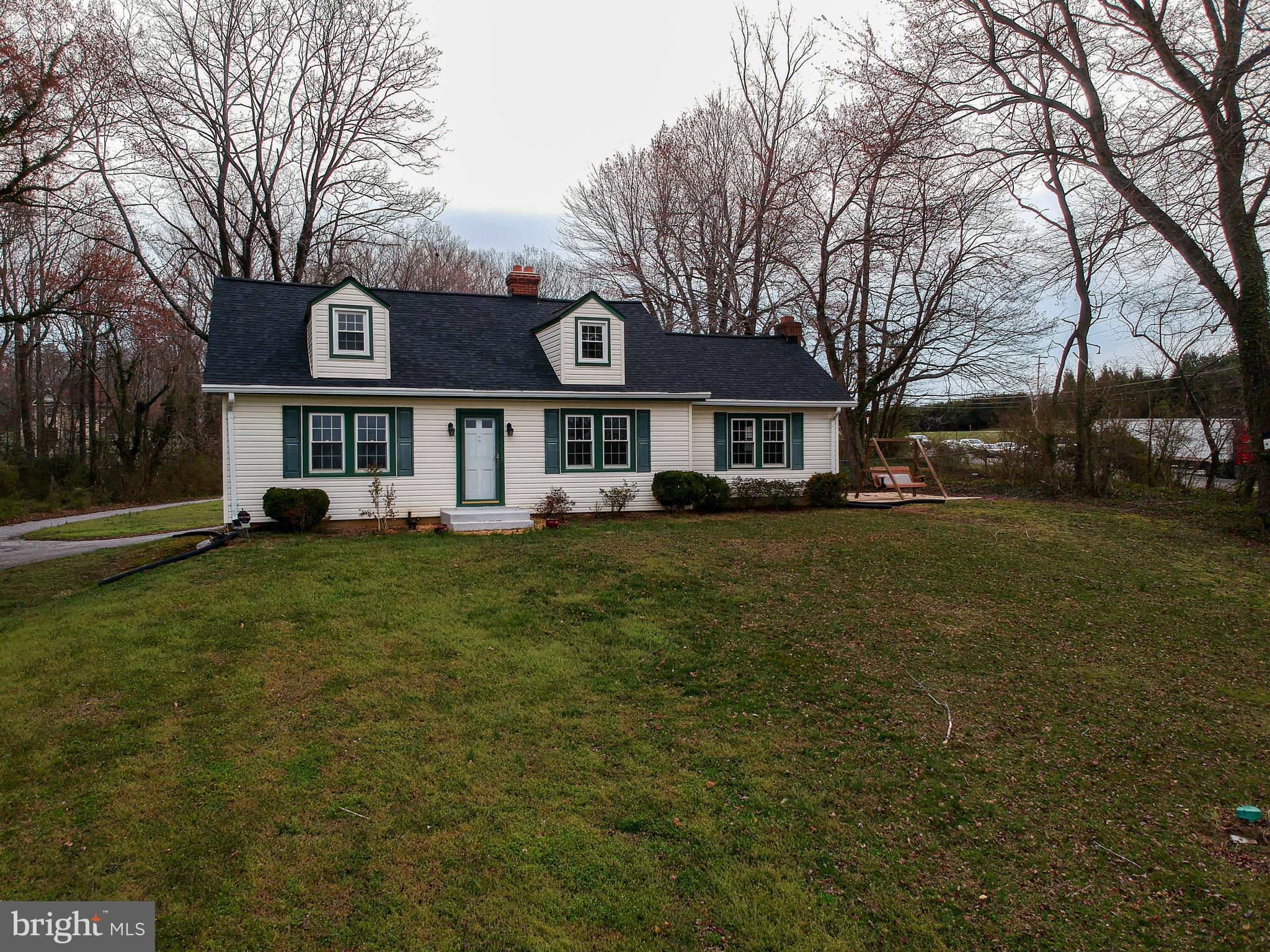 a front view of a residential apartment building with trees