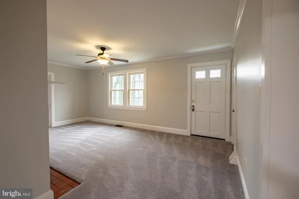a view of an empty room with a window