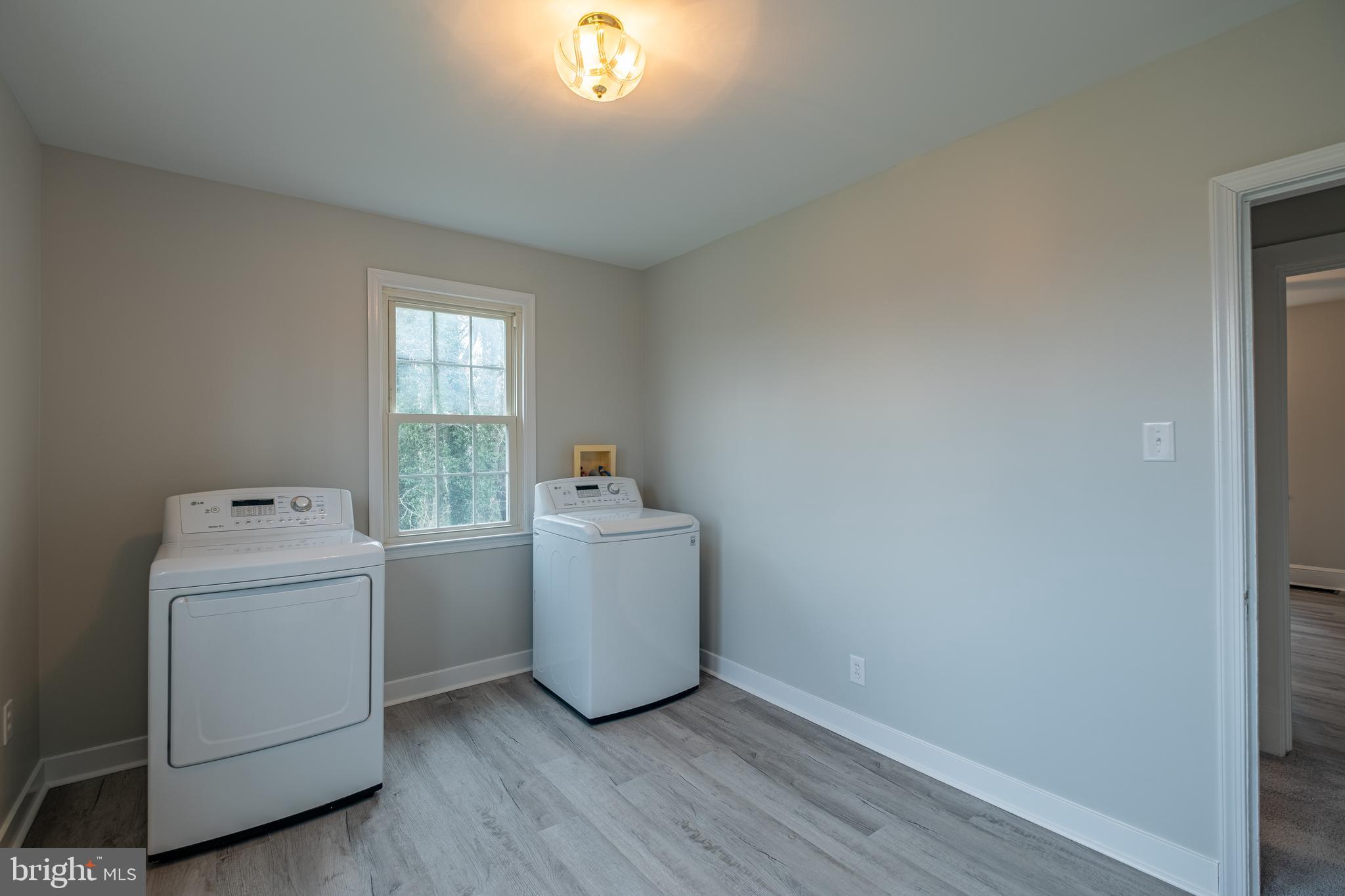 5680 Bryantown Road Bryantown, MD 20617 - Photo 17 of 35 a utility room with dryer and washer