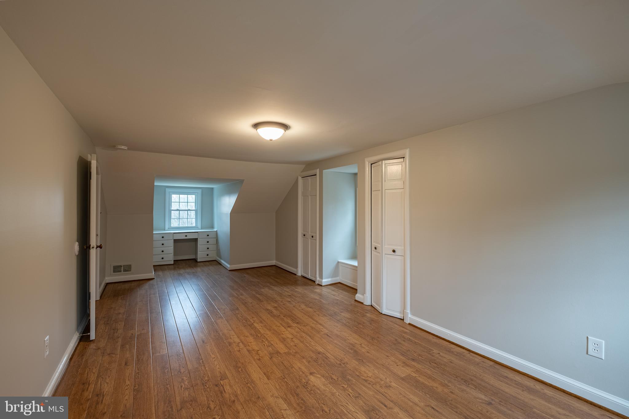 5680 Bryantown Road Bryantown, MD 20617 - Photo 25 of 35 wooden floor in an empty room with a window