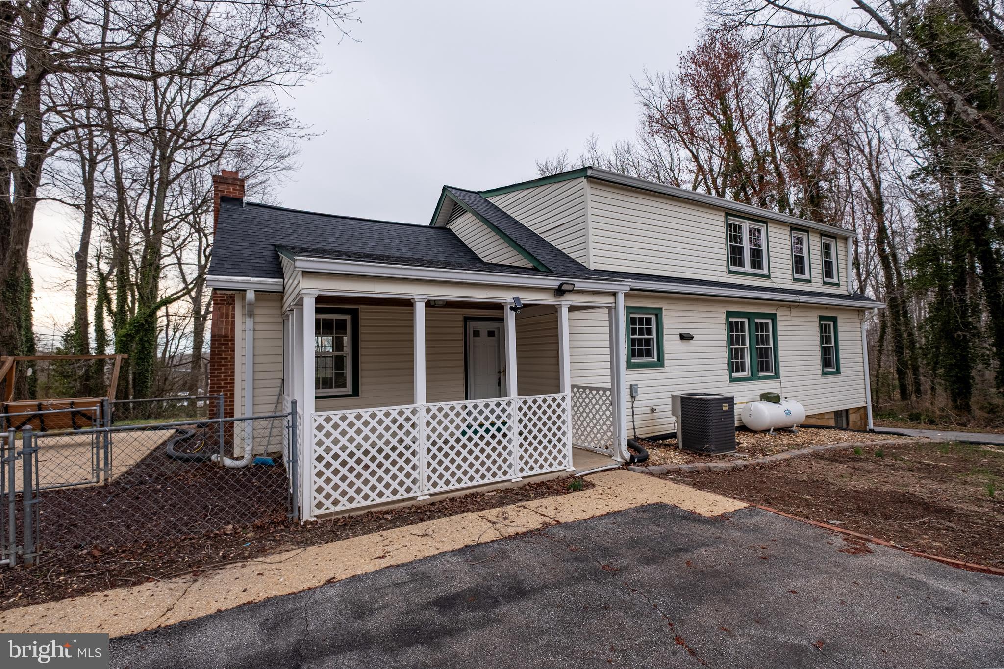 5680 Bryantown Road Bryantown, MD 20617 - Photo 3 of 35 a front view of a house with a yard