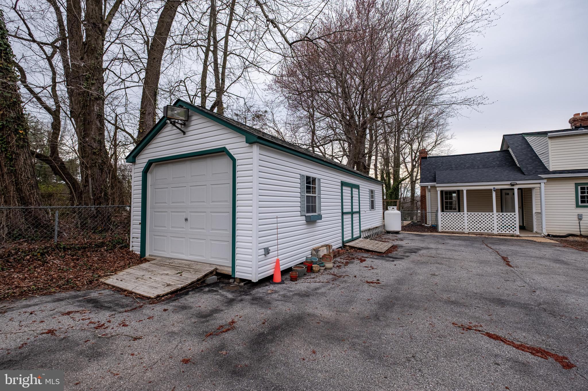 5680 Bryantown Road Bryantown, MD 20617 - Photo 35 of 35 a view of a house with a yard and garage