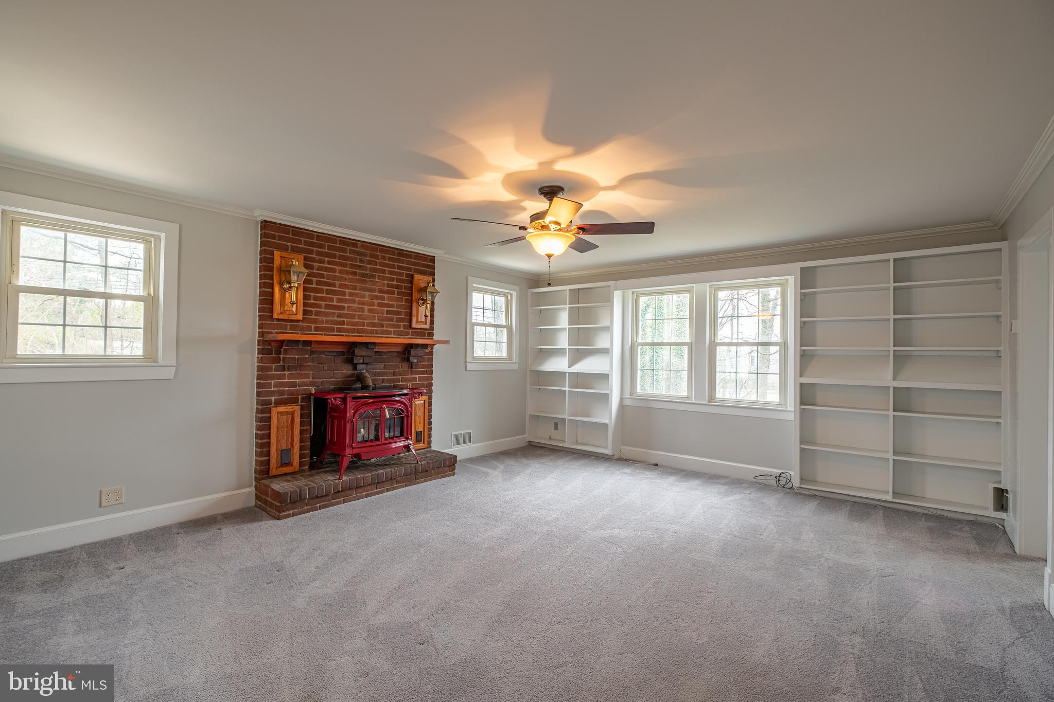5680 Bryantown Road Bryantown, MD 20617 - Photo 5 of 35 a view of an empty room with a window and fireplace