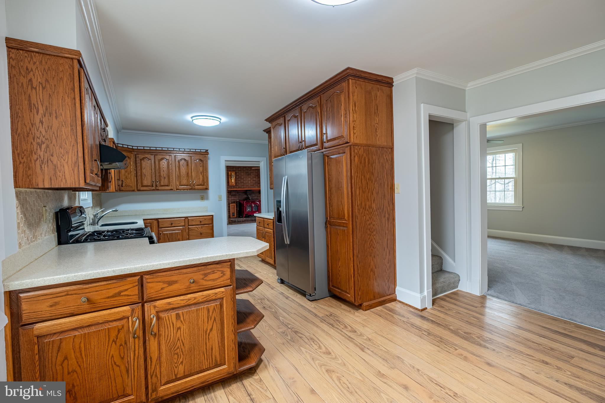 5680 Bryantown Road Bryantown, MD 20617 - Photo 9 of 35 a kitchen with stainless steel appliances granite countertop a refrigerator and a sink