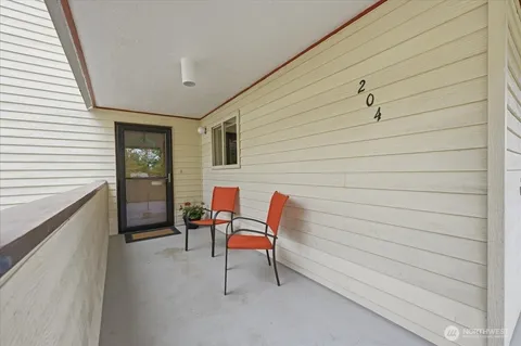 a backyard with a chair and table