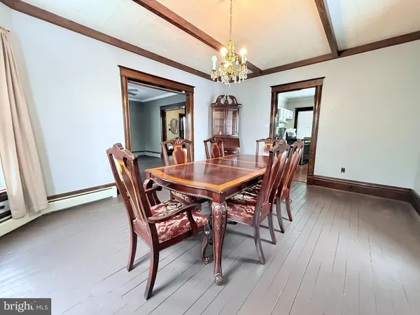 a view of a dining room with furniture and window