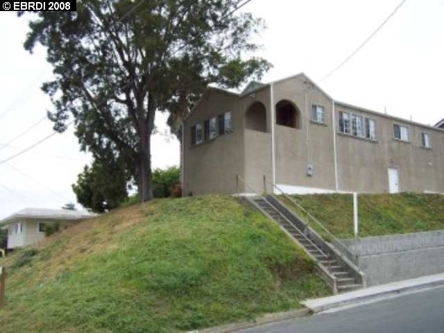 402 Rodeo Avenue Rodeo, CA 94572 - Photo 1 of 1 a front view of a house with garden