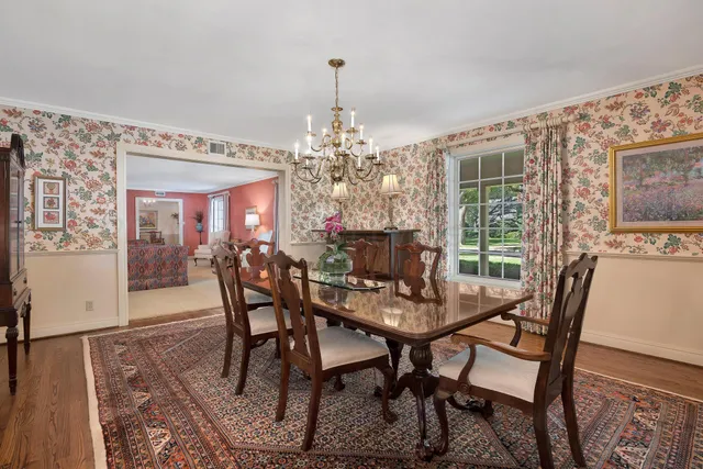 a kitchen with white cabinets and center island