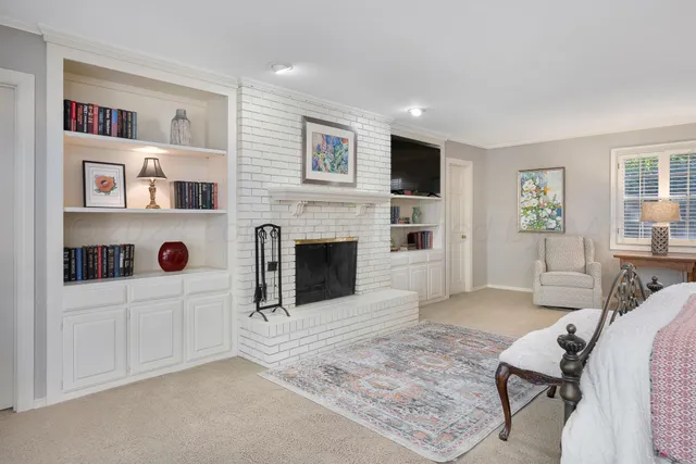 a spacious bedroom with a bed and a couch