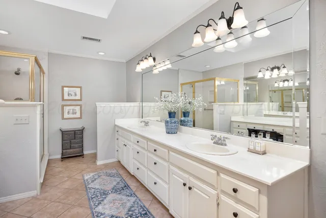 a view of a bathroom sink and mirror