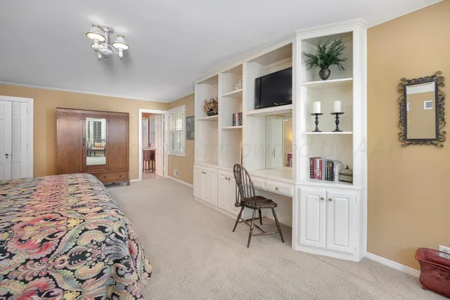 a bathroom with a toilet a sink and a mirror