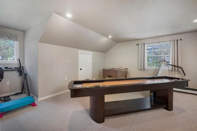 a bedroom with a bed and a chair