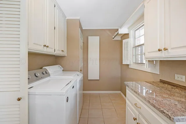 a front view of a house with a yard table and chairs