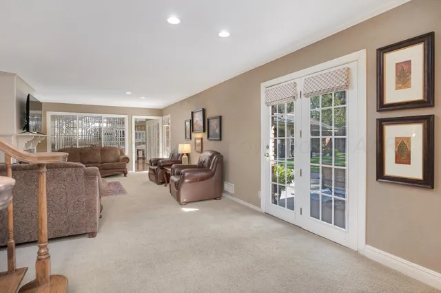 a view of a dining room with furniture and chandelier