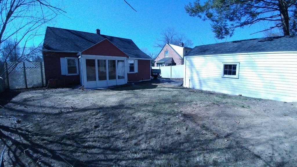 199 Harkness Avenue Springfield, MA 01118 - Photo 11 of 11 a front view of a house with a yard