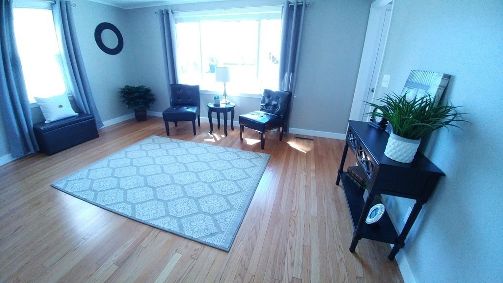 199 Harkness Avenue Springfield, MA 01118 - Photo 3 of 11 a dining room with furniture and wooden floor