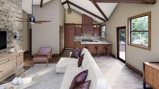 a living room with furniture a fireplace and a large window