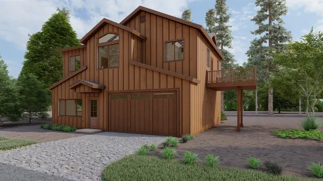 a view of a house with a yard and large tree