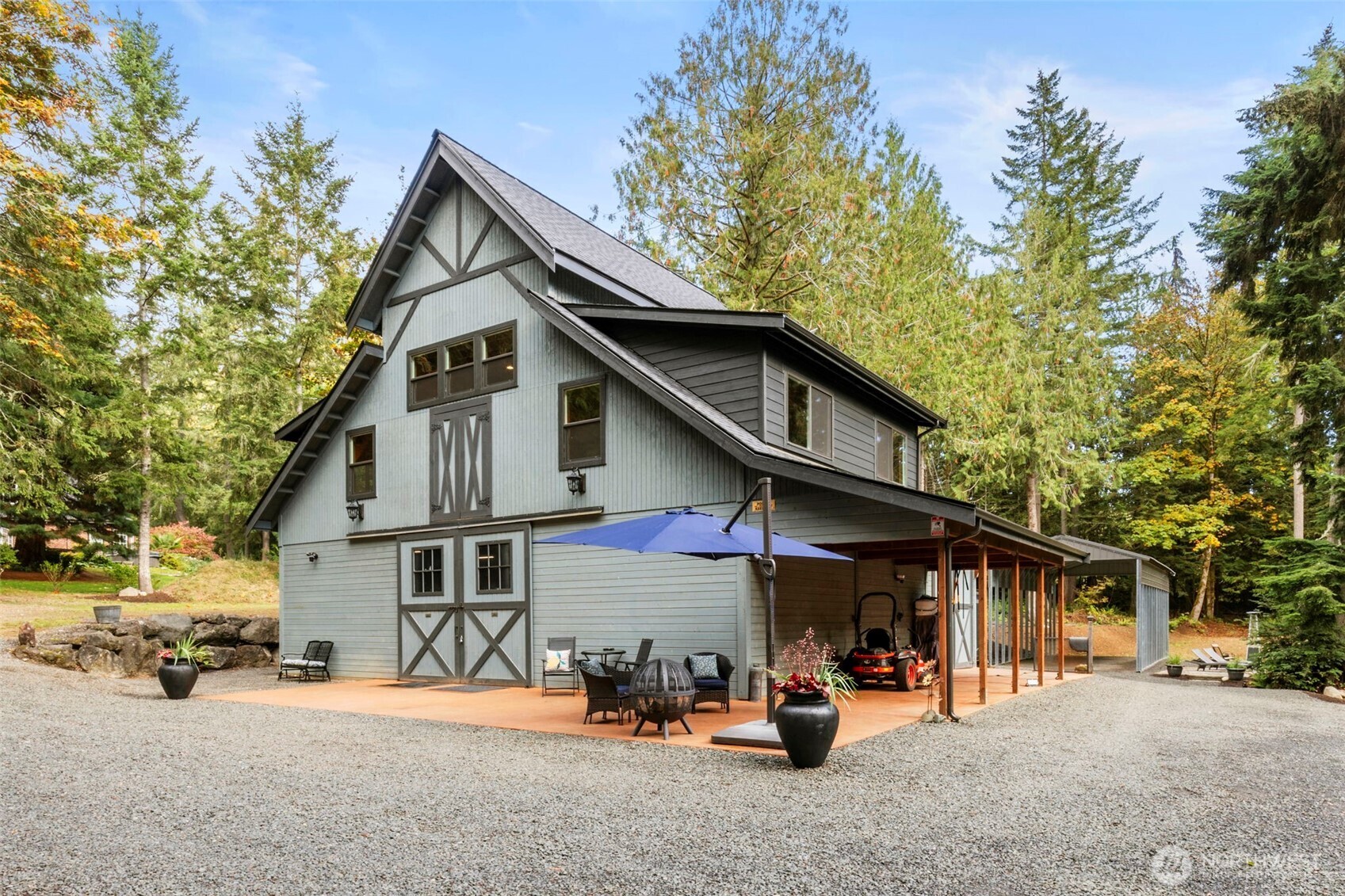 7698 Westerly Lane Northeast Bainbridge Island, WA 98110 - Photo 4 of 28 a view of a car park in front of house
