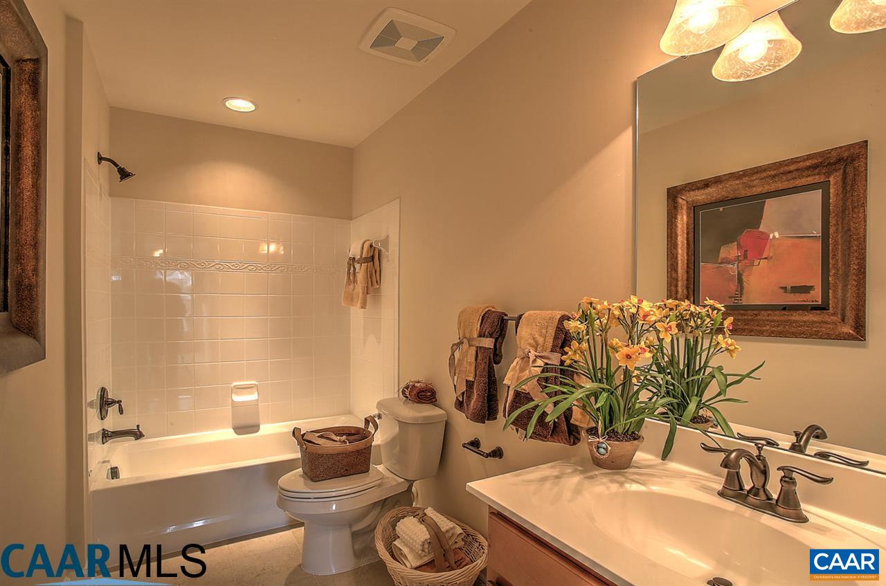18 Ridgemont Road Ruckersville, VA 22968 - Photo 16 of 26 a bathroom with a double vanity sink mirror and bathtub