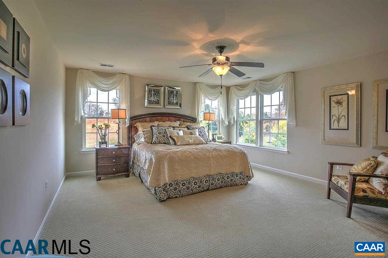 18 Ridgemont Road Ruckersville, VA 22968 - Photo 18 of 26 a bedroom with a bed dresser and a window