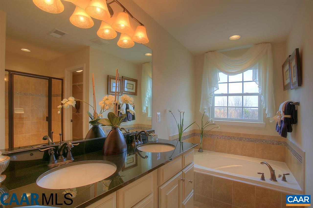 18 Ridgemont Road Ruckersville, VA 22968 - Photo 19 of 26 a bathroom with a tub sink and mirror