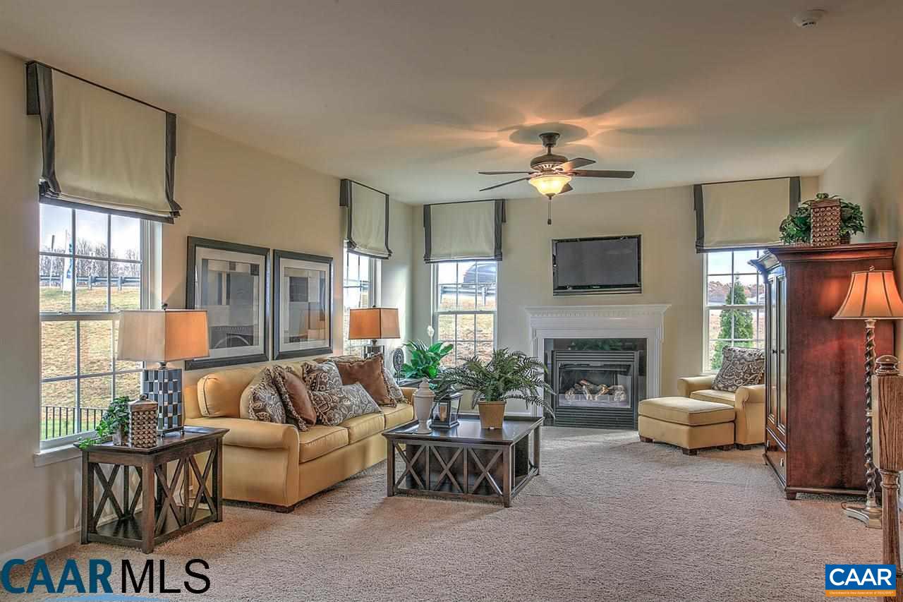 18 Ridgemont Road Ruckersville, VA 22968 - Photo 3 of 26 a living room with furniture a fireplace and a flat screen tv