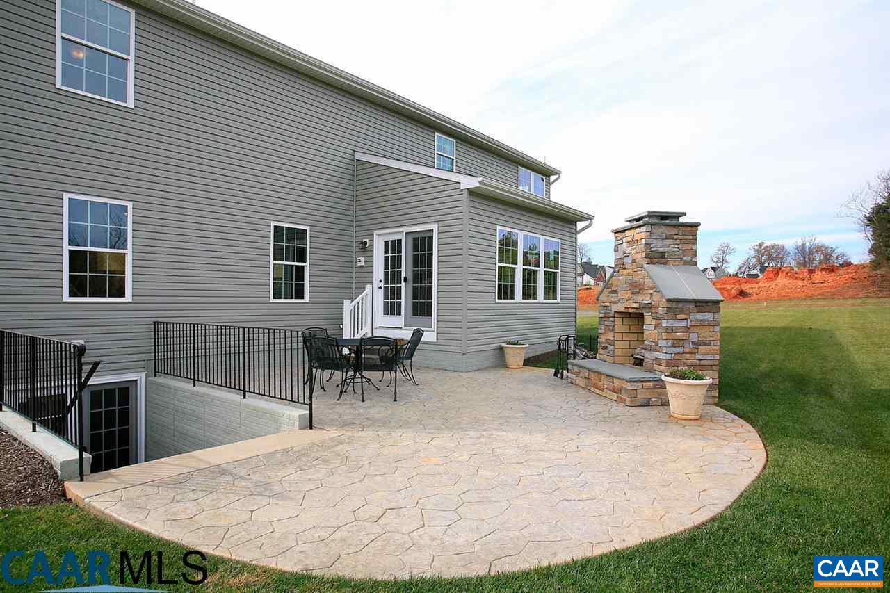 18 Ridgemont Road Ruckersville, VA 22968 - Photo 4 of 26 a backyard of a house with yard and outdoor seating