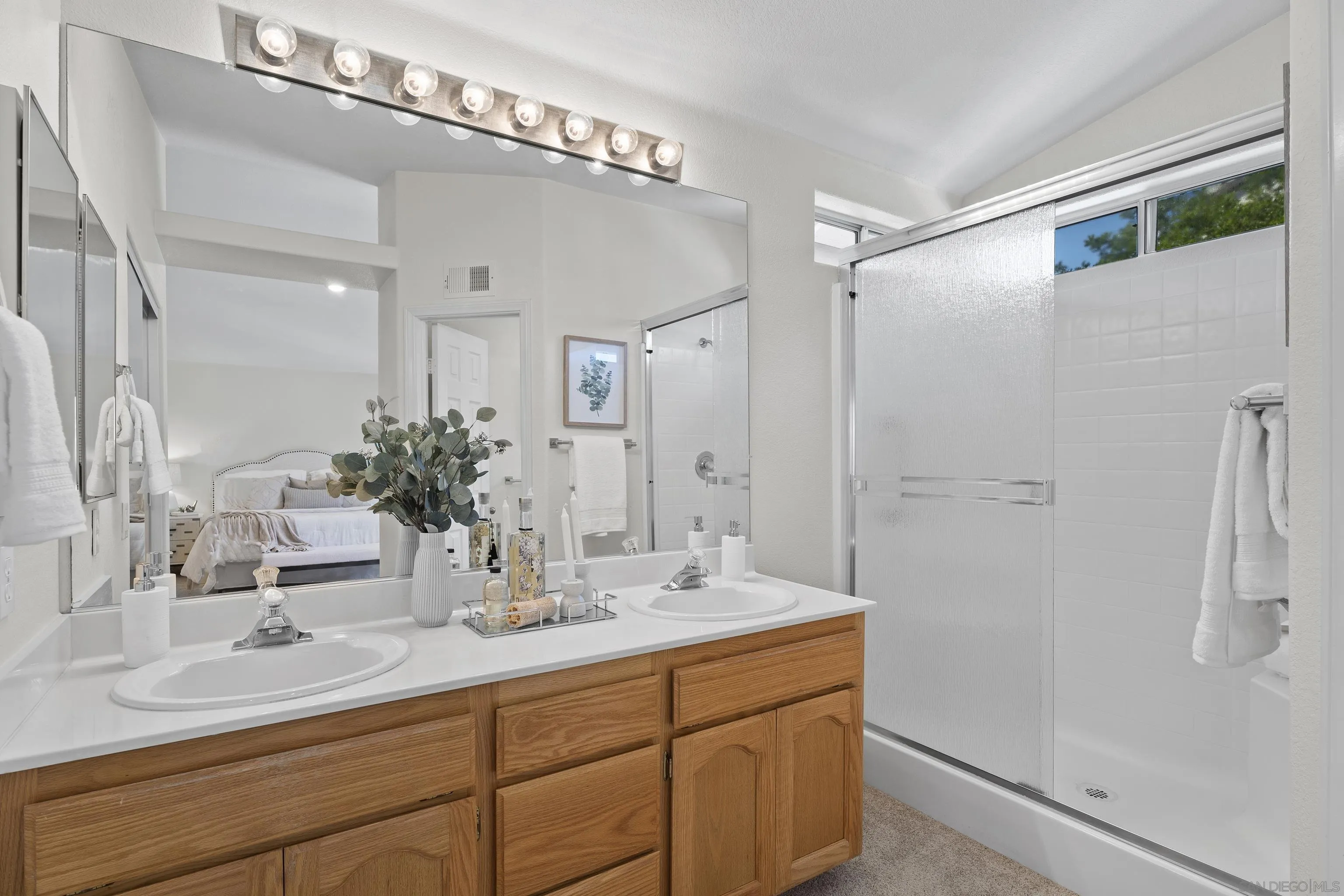 9238 Lake Valley Road El Cajon, CA 92021 - Photo 15 of 36 a bathroom with a double vanity sink mirror and shower