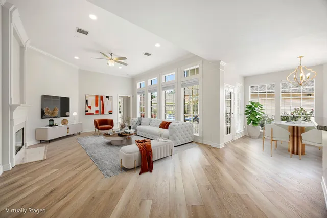 a living room with furniture fireplace and a flat screen tv