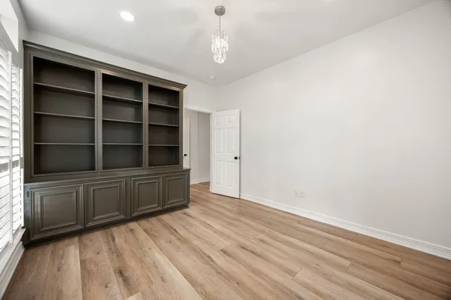 a room with cabinet and a window