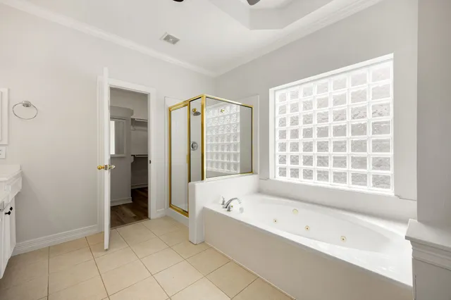 a bathroom with a bathtub and a shower