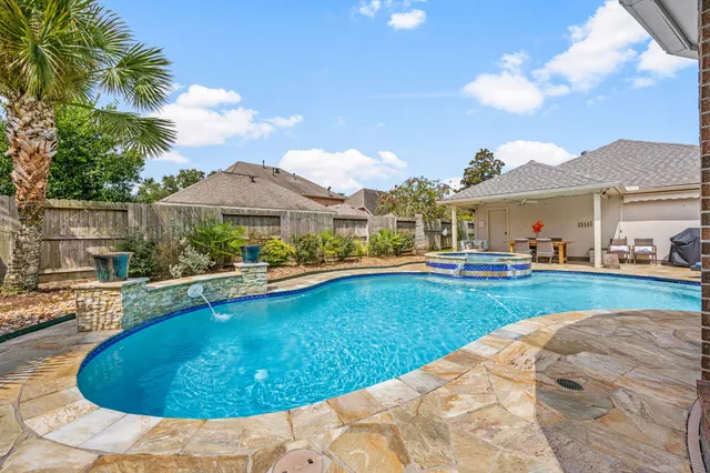 a view of a swimming pool and lounge chair