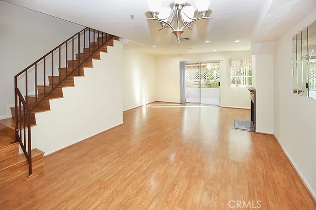 a view of an entryway with wooden floor