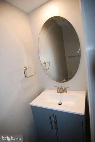 a bathroom with a sink and mirror