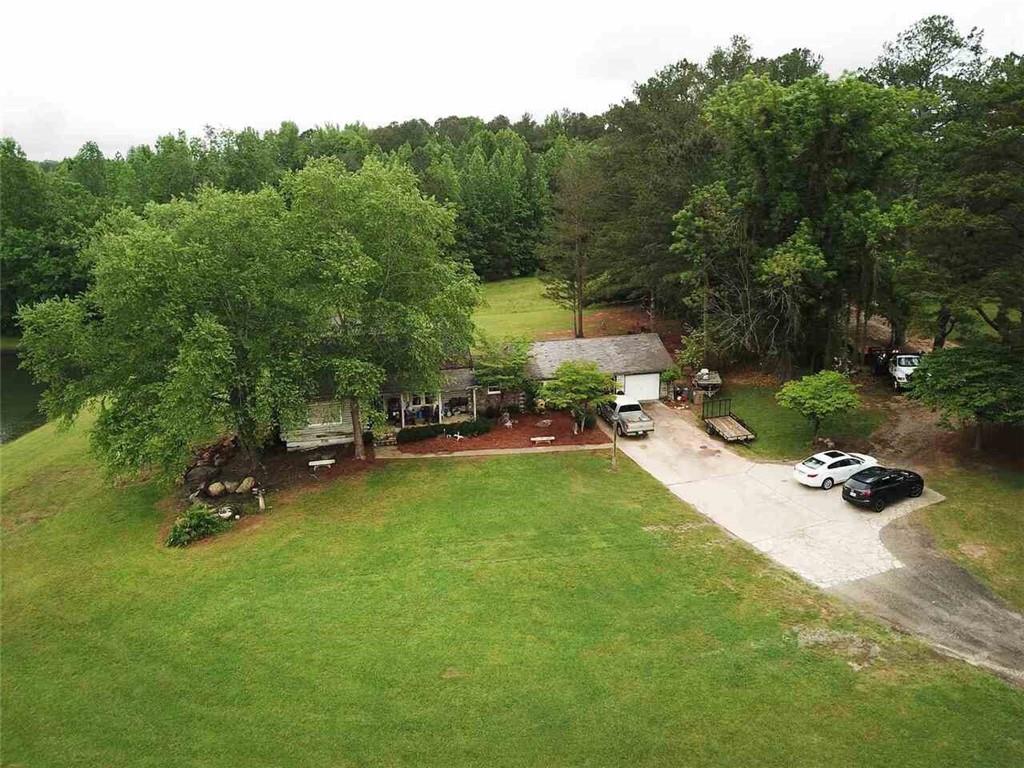 7275 Bishop Road Fairburn, GA 30213 - Photo 1 of 11 a view of a backyard with swimming pool
