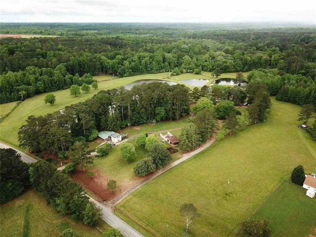 7275 Bishop Road Fairburn, GA 30213 - Photo 10 of 11 a view of a lake with a yard