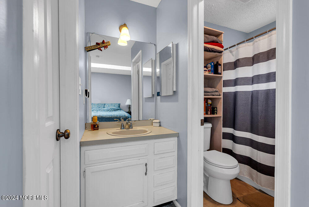 92 Concord Circle Howell, NJ 07731 - Photo 19 of 23 a bathroom with a sink toilet and shower