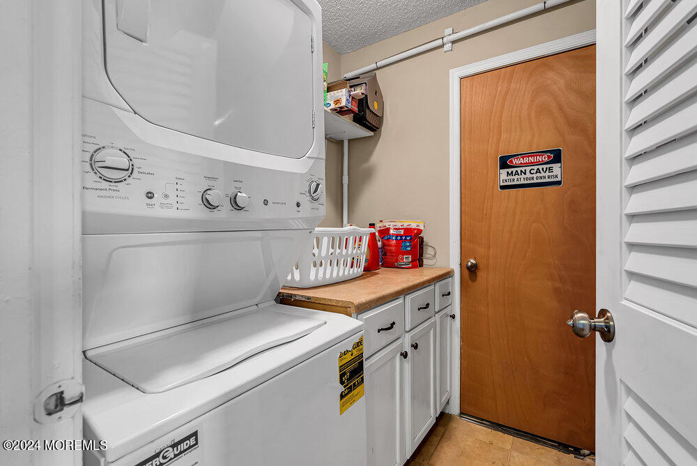 92 Concord Circle Howell, NJ 07731 - Photo 20 of 23 a utility room with washer and dryer