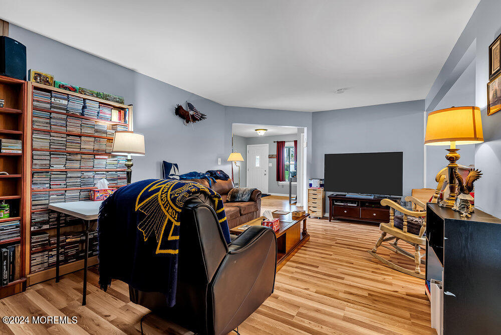 92 Concord Circle Howell, NJ 07731 - Photo 6 of 23 a living room with furniture and a flat screen tv